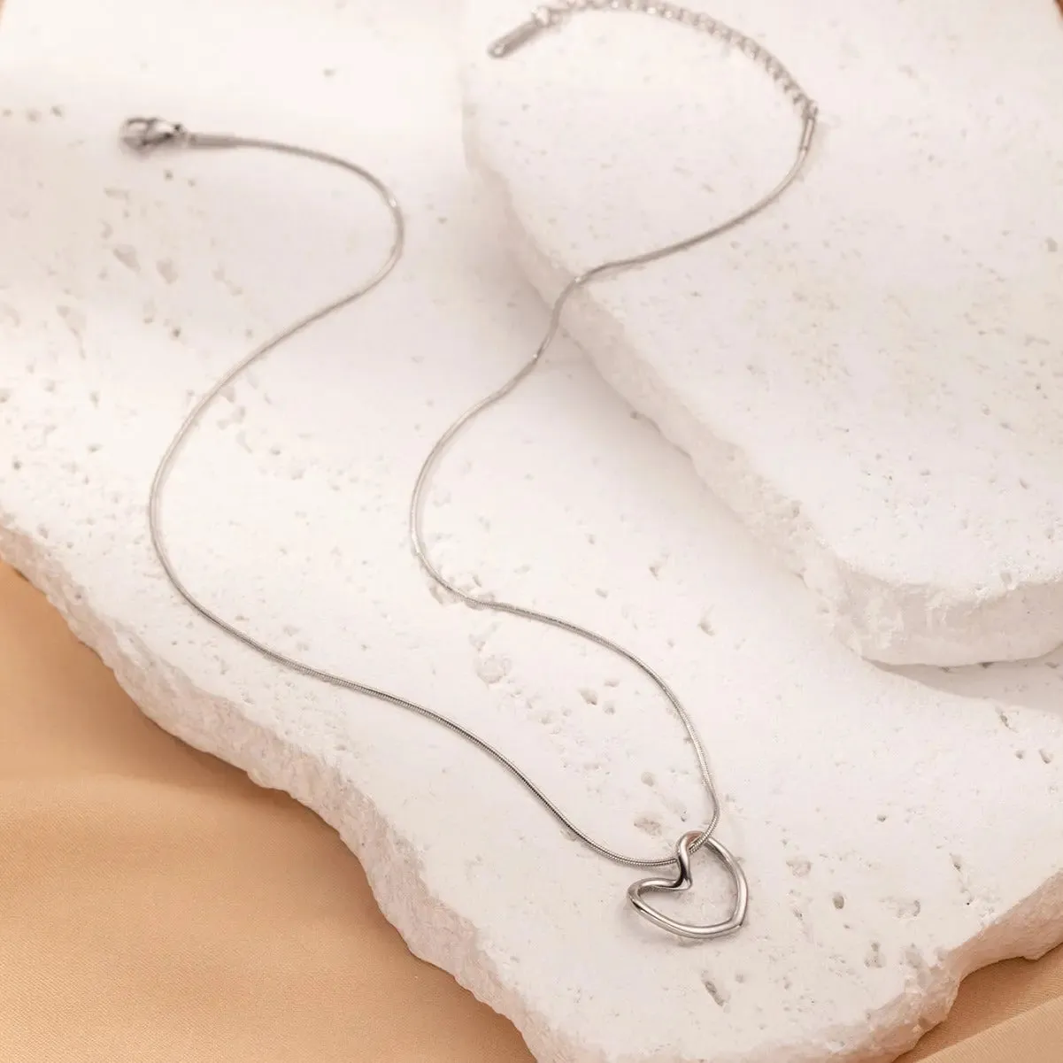 LOVCIA Clavicle Chain Elegant Titanium Steel Hollow Heart Pendant Necklace for Women