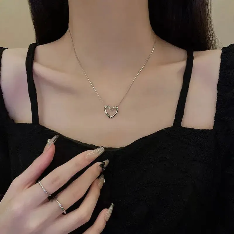 LOVCIA Clavicle Chain Elegant Titanium Steel Hollow Heart Pendant Necklace for Women