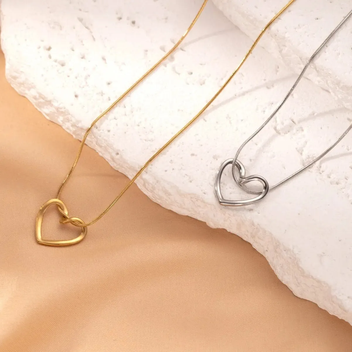 LOVCIA Clavicle Chain Elegant Titanium Steel Hollow Heart Pendant Necklace for Women