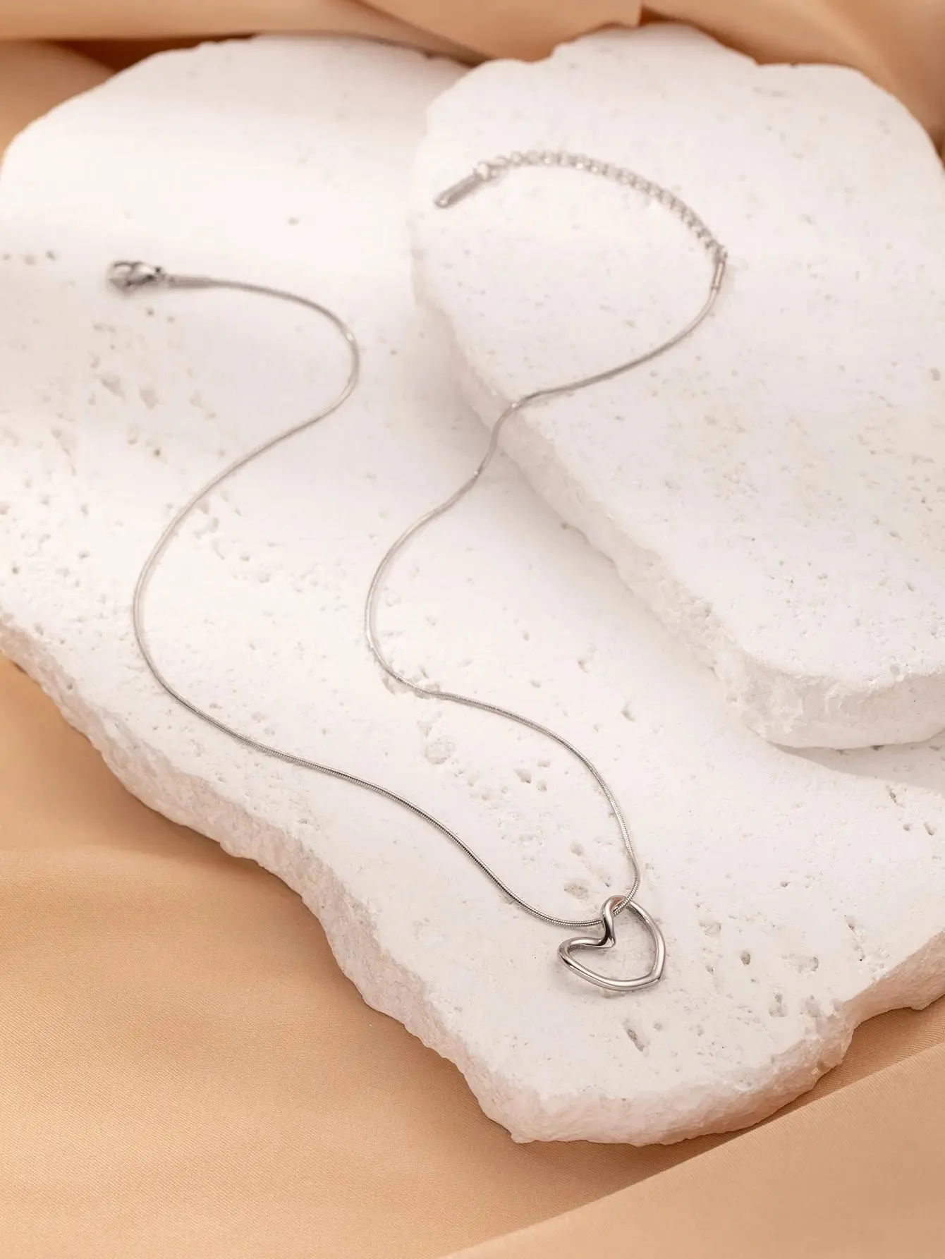 LOVCIA Clavicle Chain Elegant Titanium Steel Hollow Heart Pendant Necklace for Women