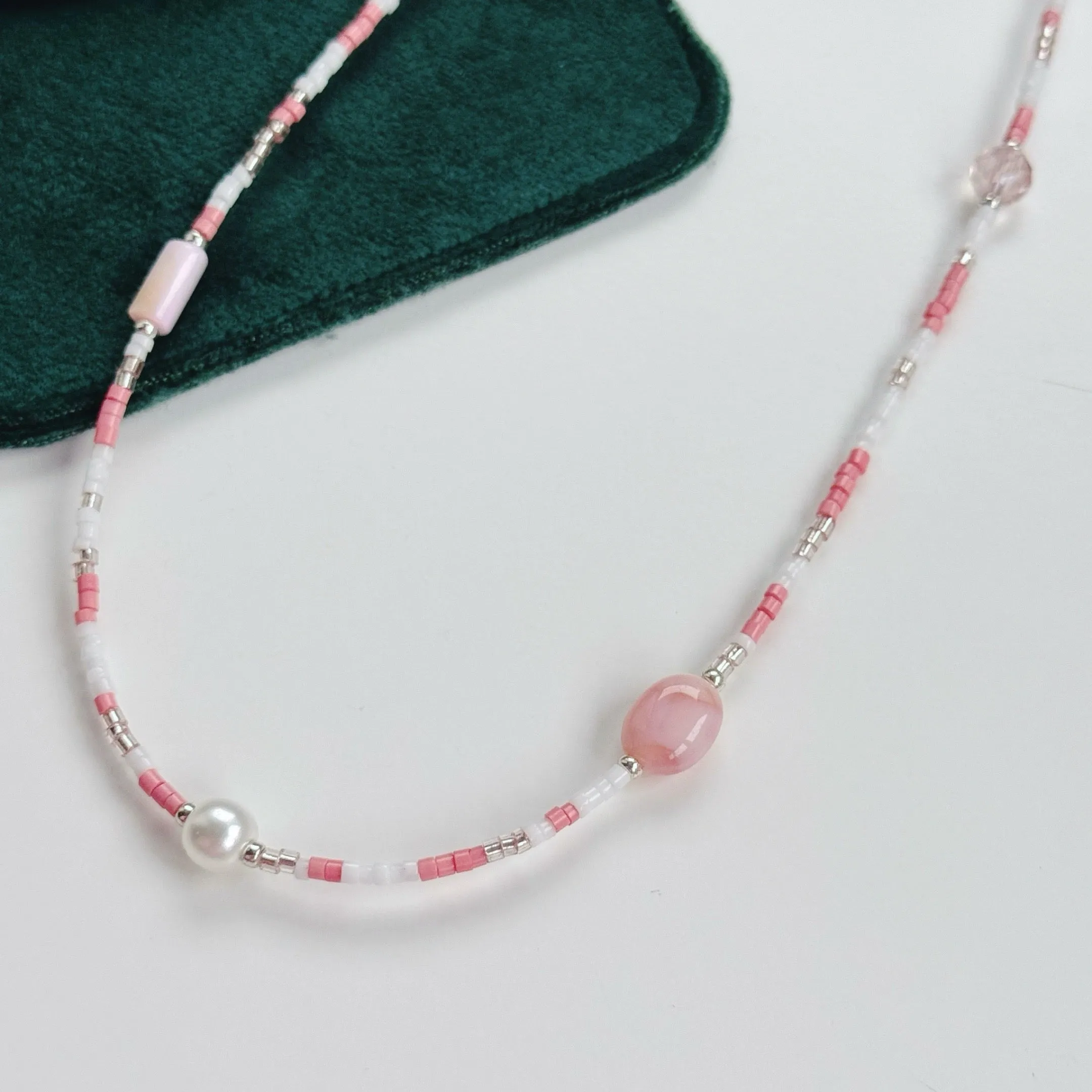 Peachy pearl necklaces