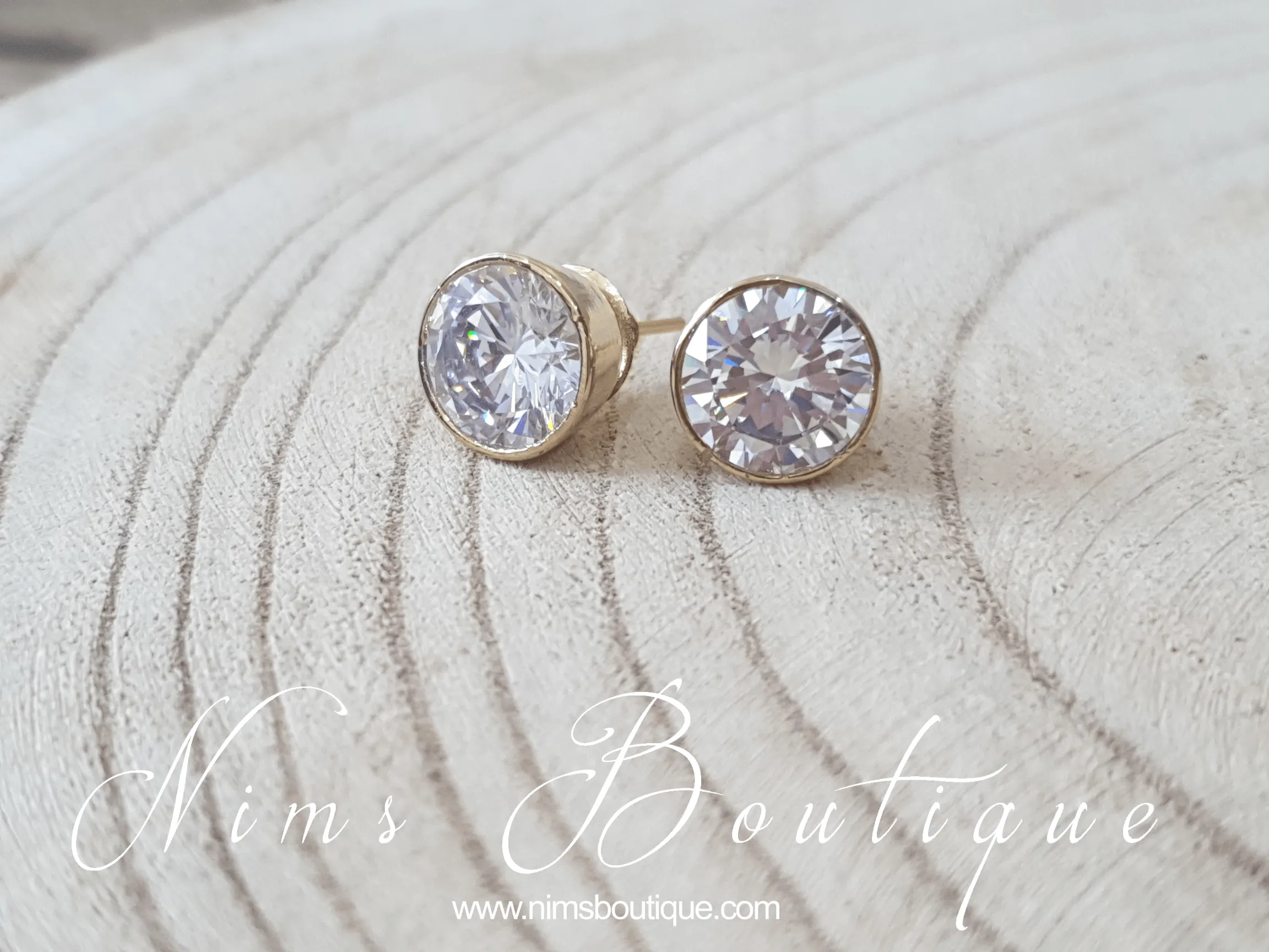 The NB Clear stud earrings